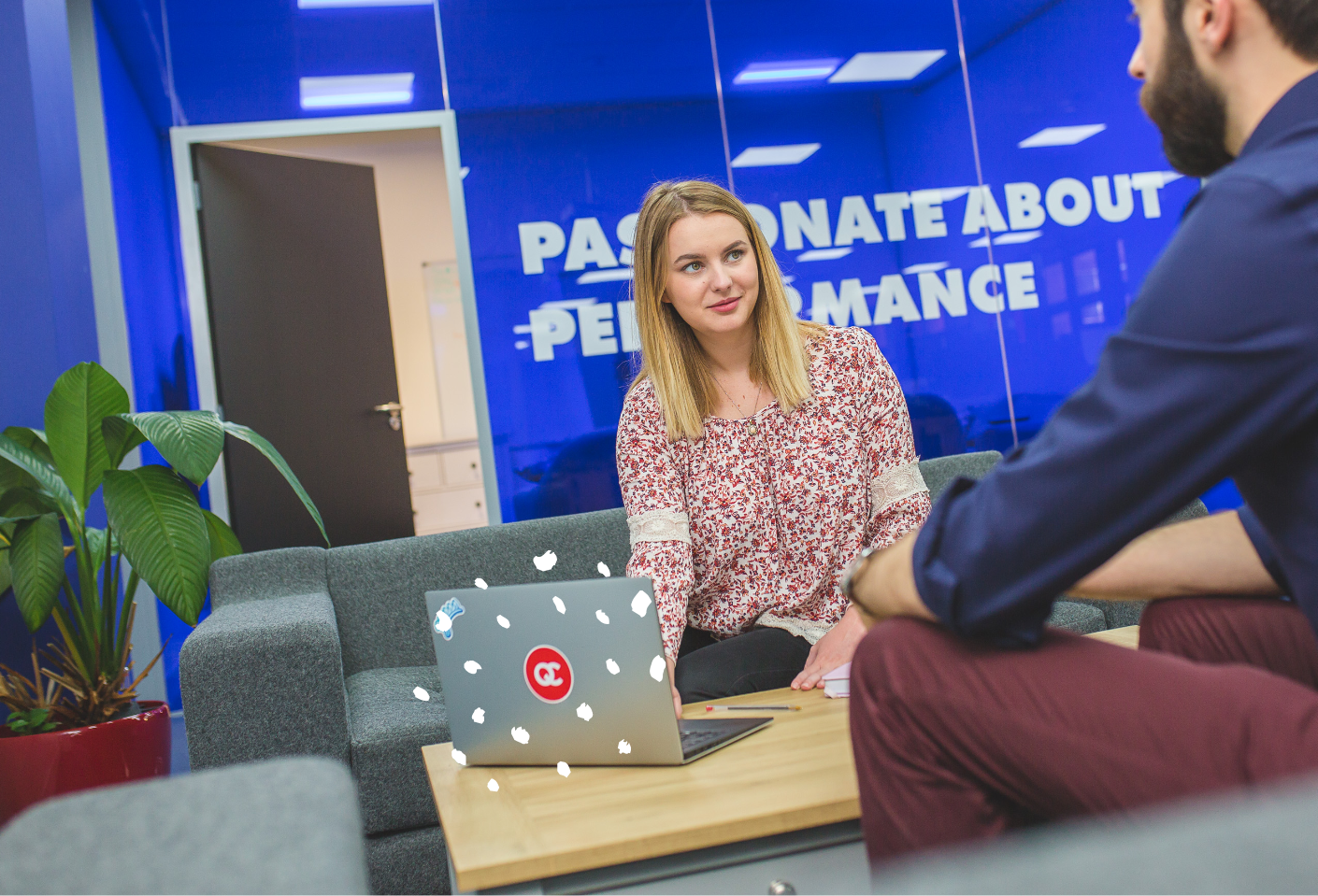 QueryClick Team in front of Blue Meeting Room